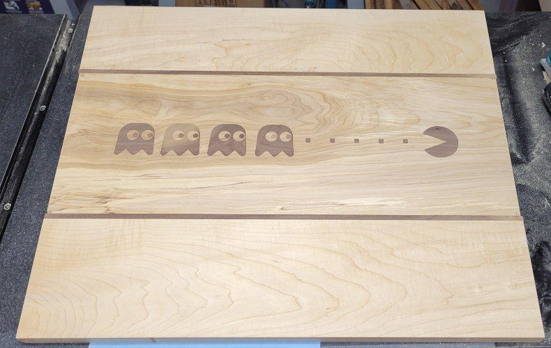 Work in progress, a book stand for a friend made with maple and junglans nigra and a carved Pacm... and Ghost