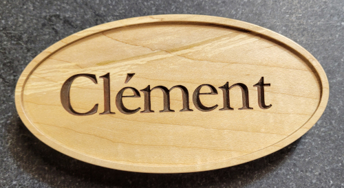 A custom sign with meaple wood and painted letters