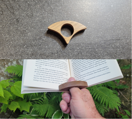 A thumb ring book holder made with junglans nigra